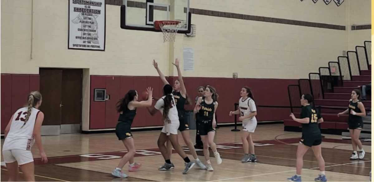  Bay Shore Girls Varsity Basketball team in a game against Ward Melville.
